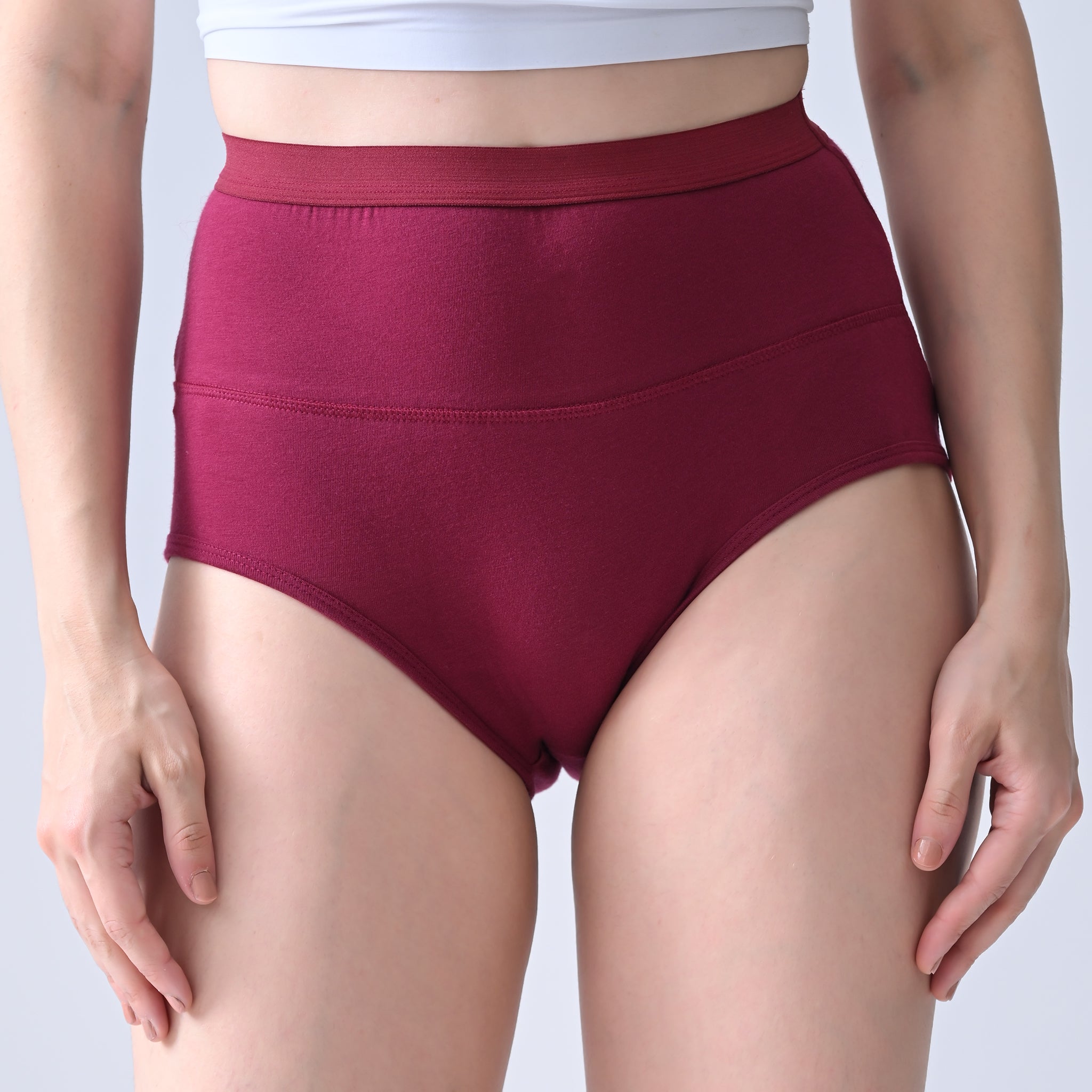 Woomly's leakproof and Urine leak Maroon high-waisted underwear on a plain background