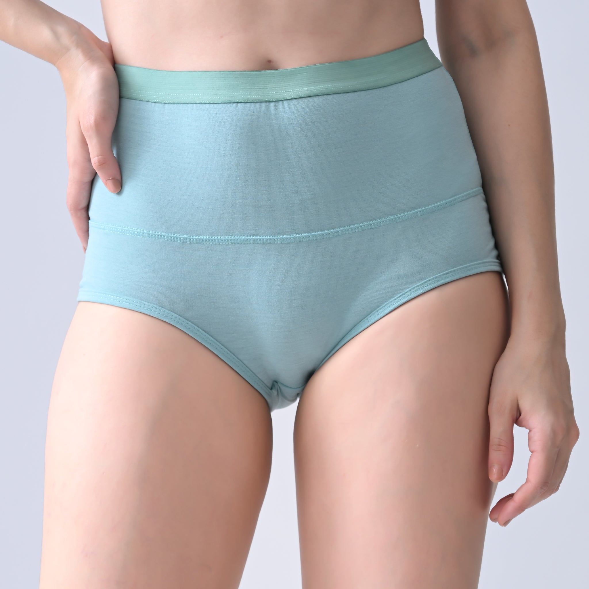Woomly's leakproof and Urine leak Teal high-waisted underwear on a plain background